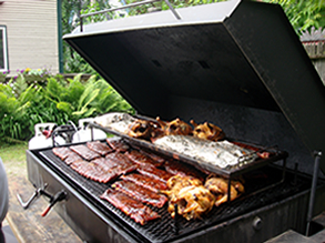 Ribs, chicken, and pork on the grill